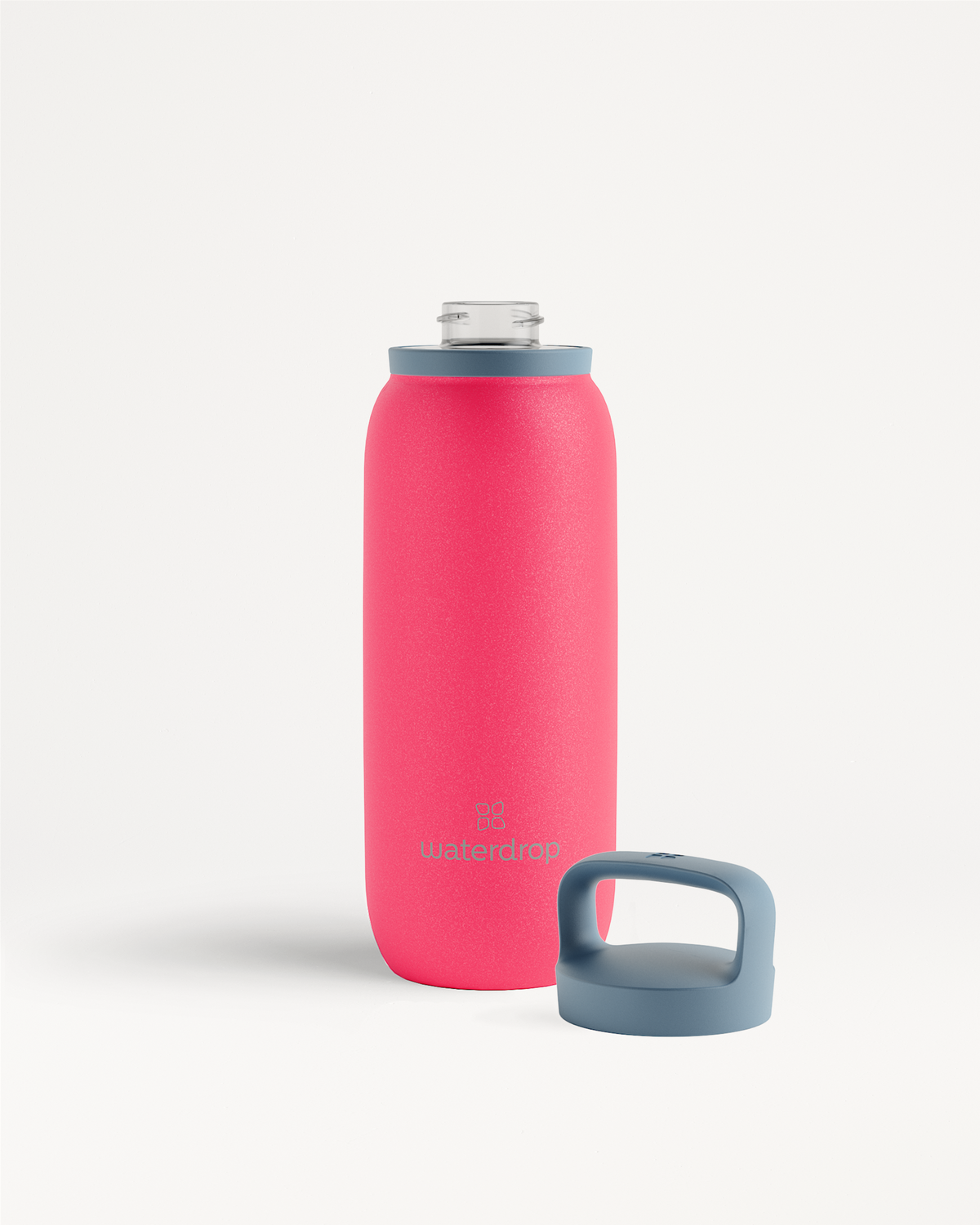All-Purpose Thermo · Spout Lid, een cilindervormige roze waterfles met grijze dop, ontworpen om dranken tot 24 uur ijskoud te houden dankzij dubbelwandig roestvrij staal en brede opening voor ijsblokjes.