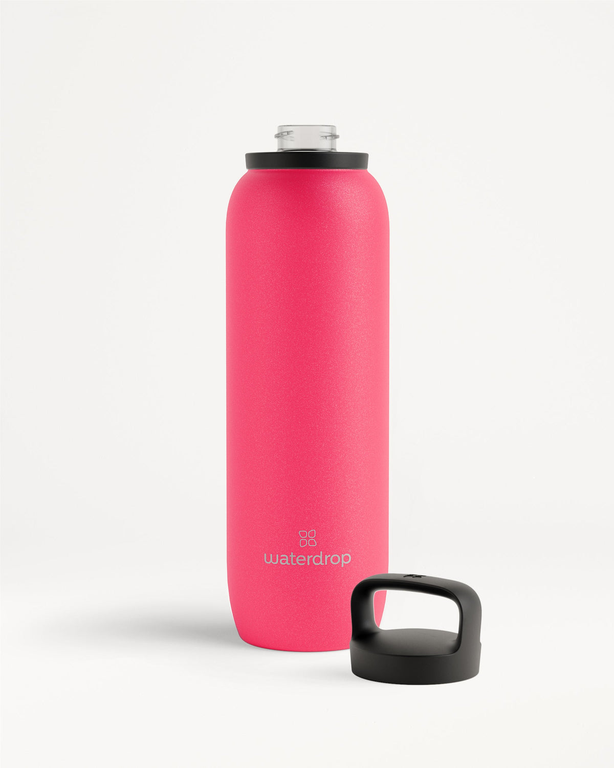 All-Purpose Thermo · Dop met drinktuit: Een hoge, matte, roze fles van roestvrij staal met brede opening en zwart schroefdeksel, ideaal voor het koel houden van dranken tot 24 uur.