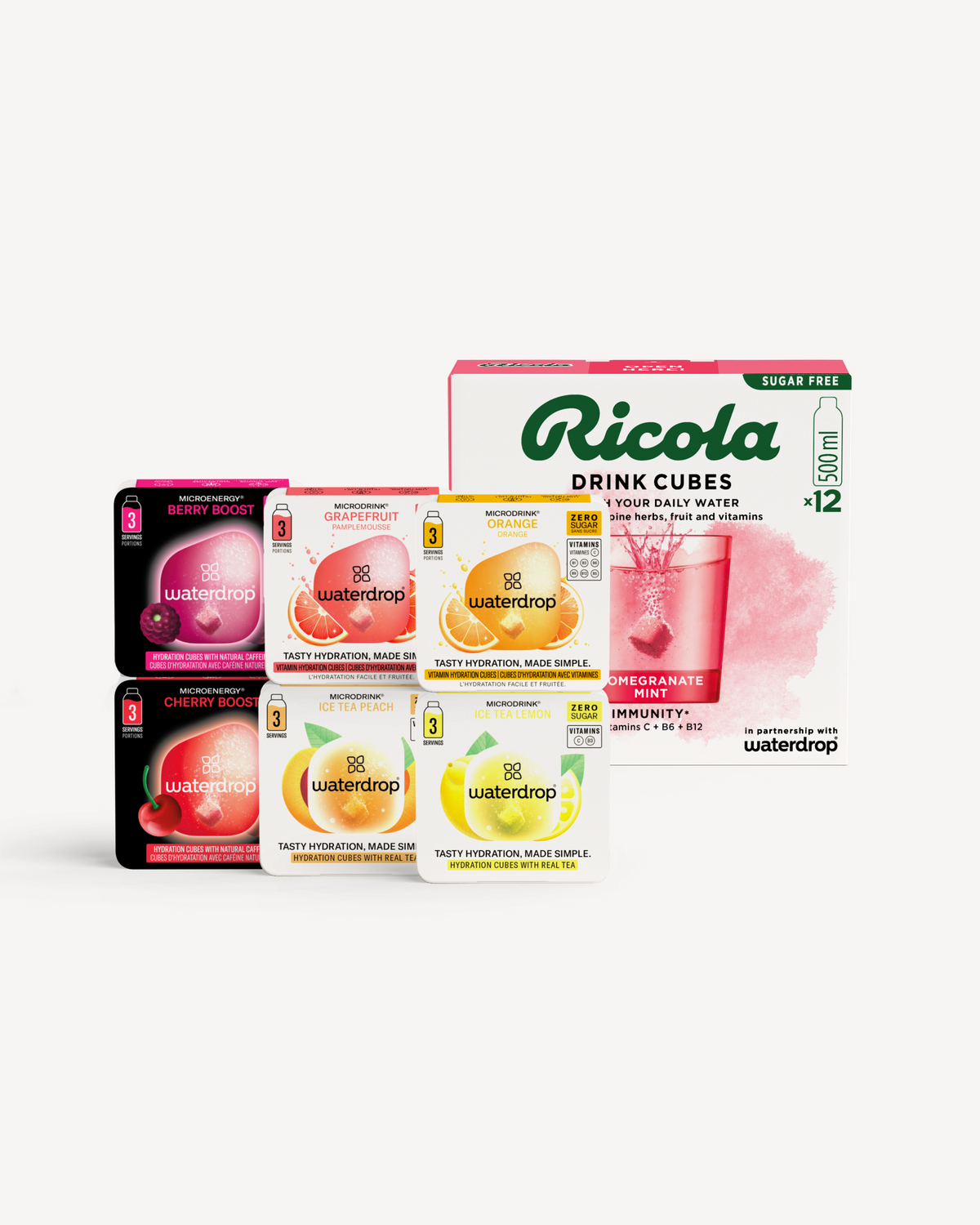 Taster Set waterdrop® x Ricola: Stapel van kleine doosjes waterdrop® hydratatieblokjes in diverse smaken voor Microdrink en Microenergy, voor een grotere doos Ricola suikervrije Drink Cubes, alles in kartonnen verpakkingen.