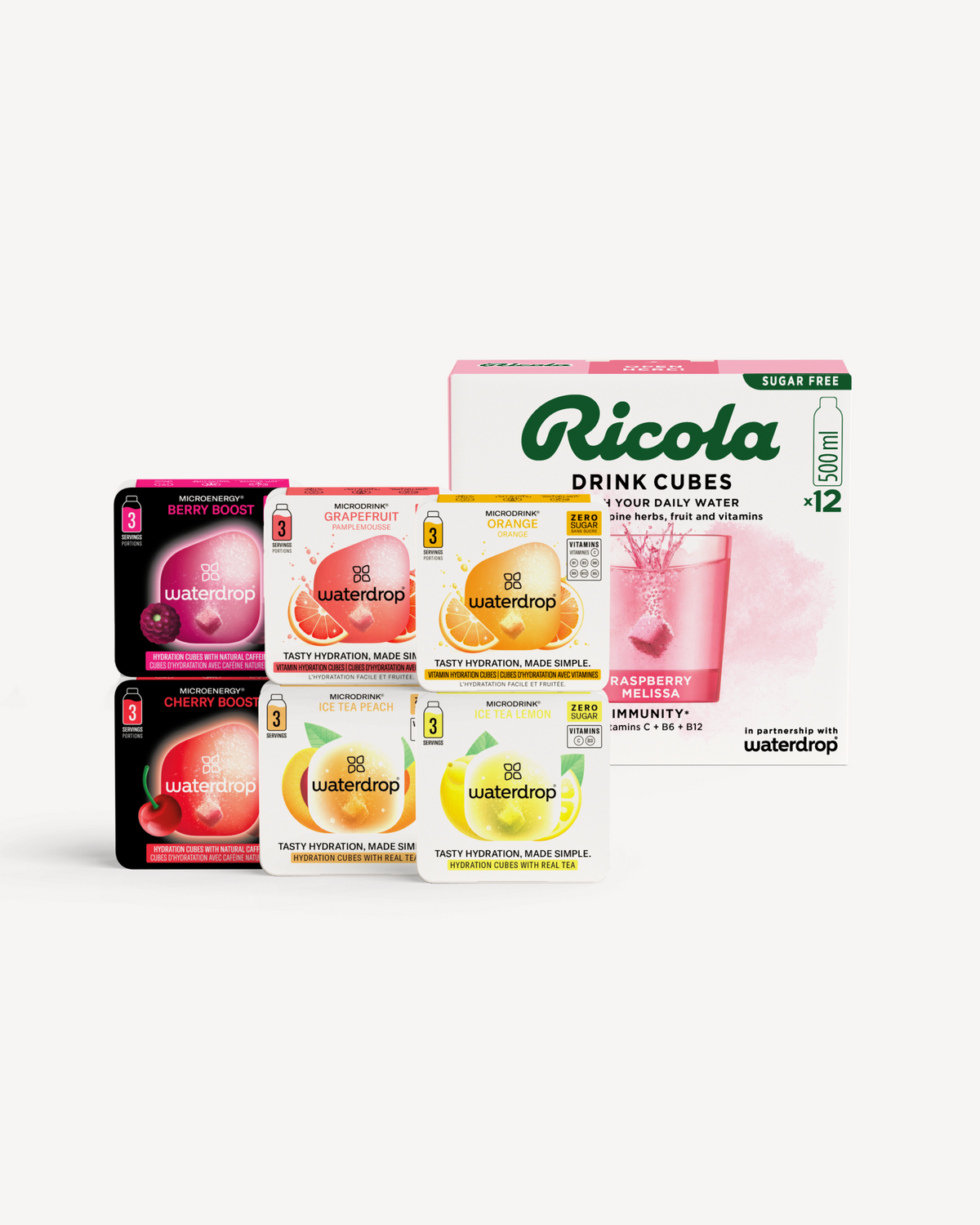 waterdrop® x Ricola Taster Set: Een Ricola Drink Cubes-doos (Raspberry Melissa, 12 stuks) naast zes waterdrop® Microdrink-doosjes, waaronder MicroEnergy Berry Boost en MicroDrink Grapefruit, voor smaakvolle en verrijkte hydratatie.