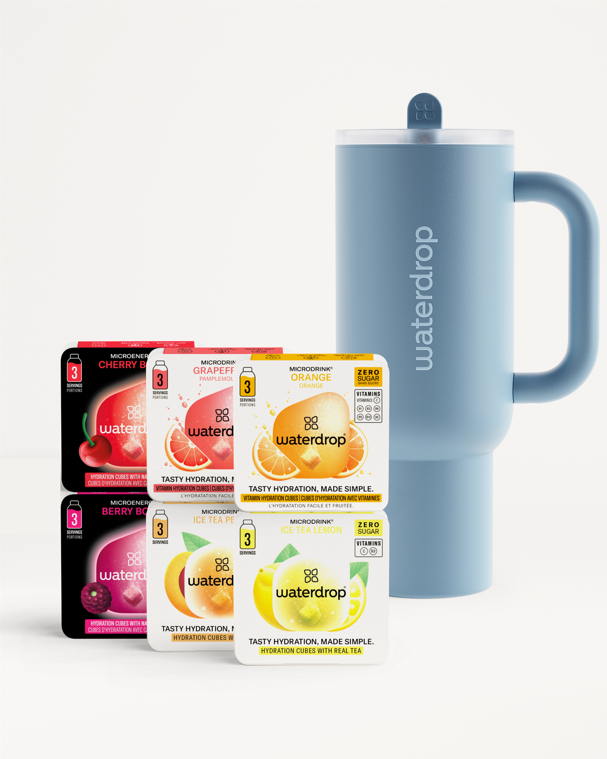 Starter Set Explorer Thermo Drinkbeker met Waterdrop Microdrink smaken: Cherry Berry, Grapefruit, Orange, Berry Boost, Ice Tea Peach en Ice Tea Lemon, naast een lichtblauwe travel mug.