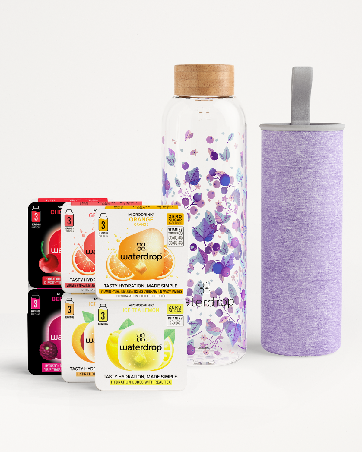 Starter Set Glass met vijf blisterverpakkingen van suikervrije microdrink-smaakblokjes (Orange, Ice Tea Lemon, Grapefruit, Cherry, Berry) en een glazen waterfles met bamboedop en bijpassende paarse hoes.