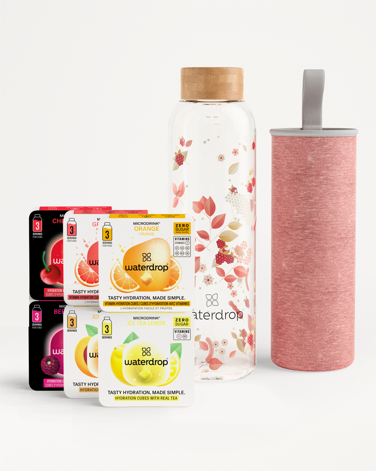 Starter Set Glass met een elegante glazen waterfles, houten-look dop, bloemenpatroon, roze draaghoes, en vier doosjes Waterdrop cubes in diverse smaken voor suikervrije, vitamine-rijke microdrinks.