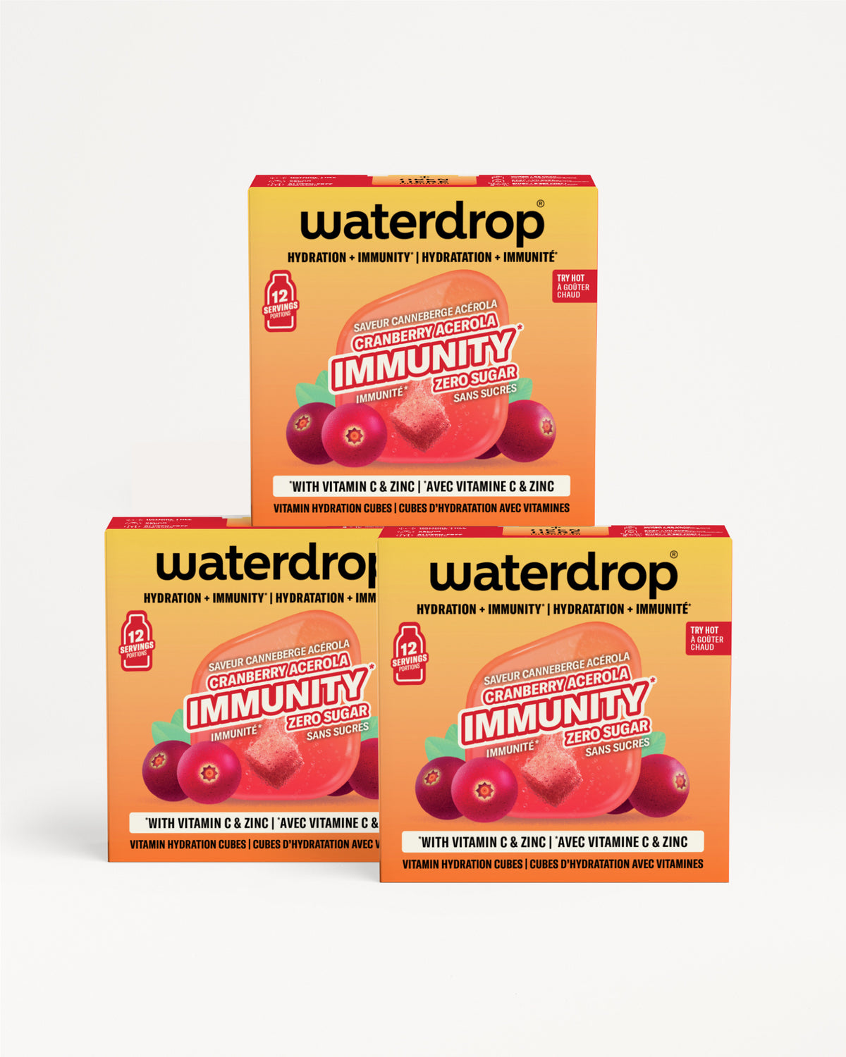Drie oranje-geel Waterdrop-immuniteitsboxes stapelen elkaar op met bessenillustraties.