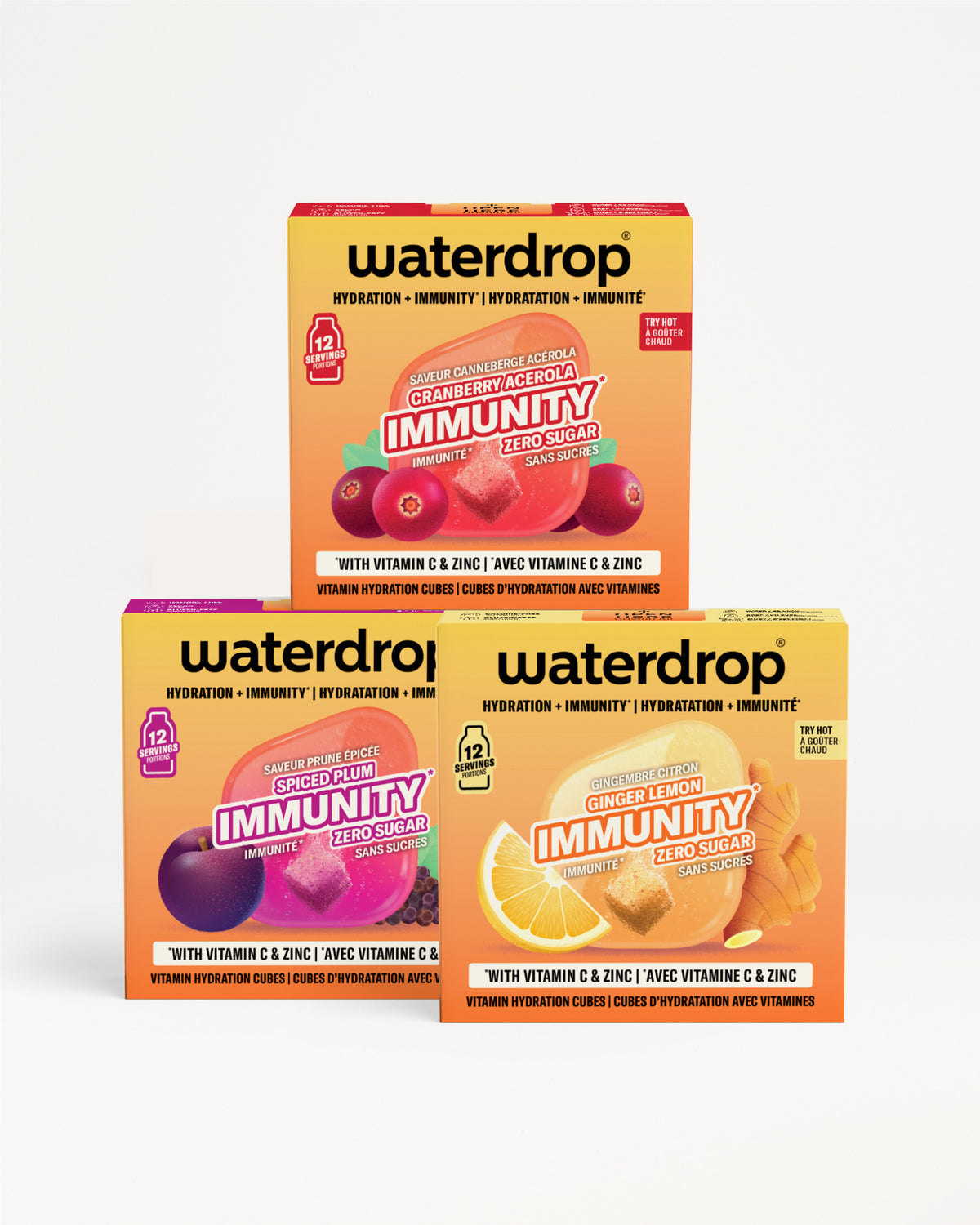Drie Waterdrop Immunity-dozen gestapeld in een piramide tegen een witte achtergrond.
