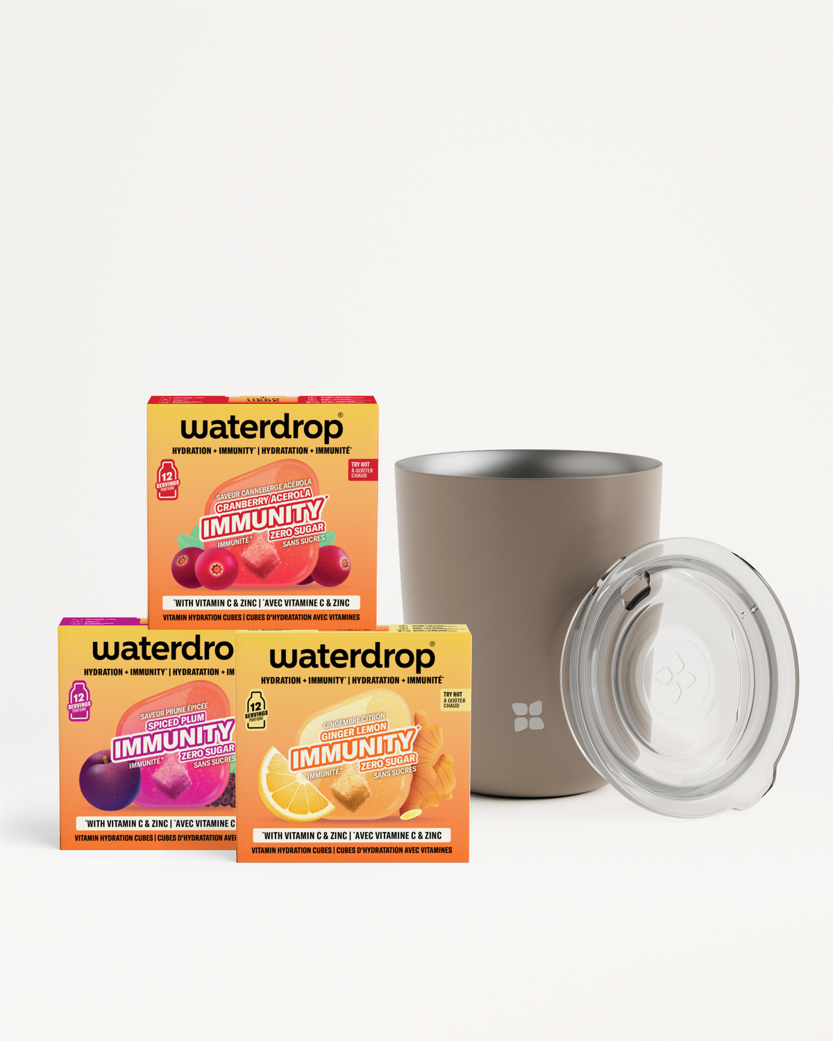 Set van drie kleurrijke drinkmix-doosjes en een roestvrijstalen tumbler met doorschijnende deksel.