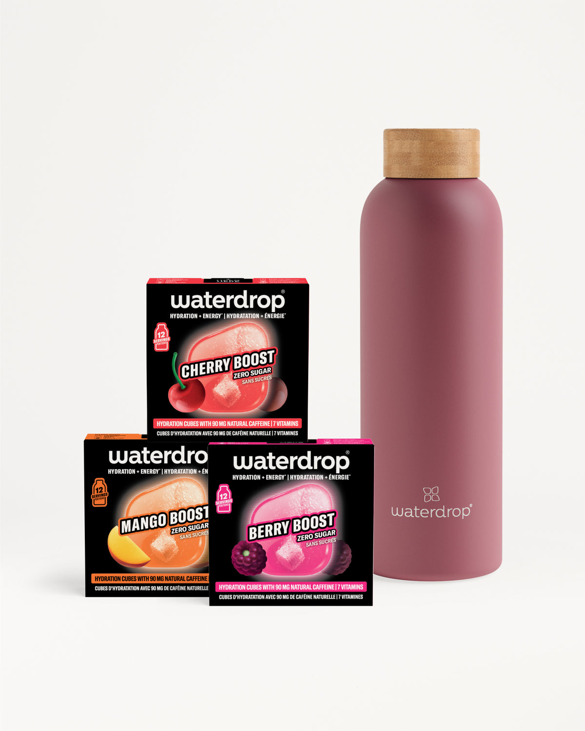 Drie compacte Waterdrop-boostersdoosjes naast een roze herbruikbare fles met houten deksel.