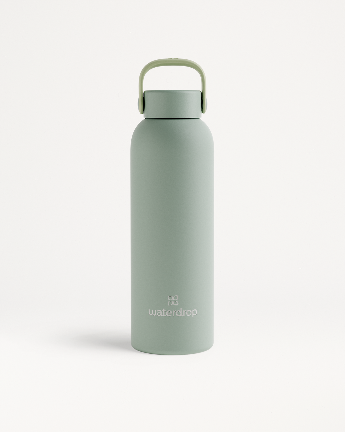 RVS Drinkfles · Flessendop met draaglus, een matte sage-groene fles van 600 ml, met dubbelwandig roestvrij staal voor langdurig gekoeld of warm drinken. 'waterdrop' logo en draaglus dop inbegrepen.