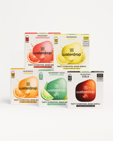 Vijf waterdrop® Microdrink-doosjes met 12 serveerblokken, inclusief smaken: Grapefruit, Citroen (suikervrij), Sinaasappel, Citroen-Limoen (Focus), en Cola (suikervrij). Producttitel: Set: 30 dagen suikervrije frisdrank.