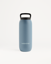 All-Purpose Thermo · Loop Lid: een blauwe waterfles met zwarte handgreep, gemaakt van dubbelwandig roestvrij staal, ideaal voor het lang koel of warm houden van dranken, verkrijgbaar in meerdere maten.