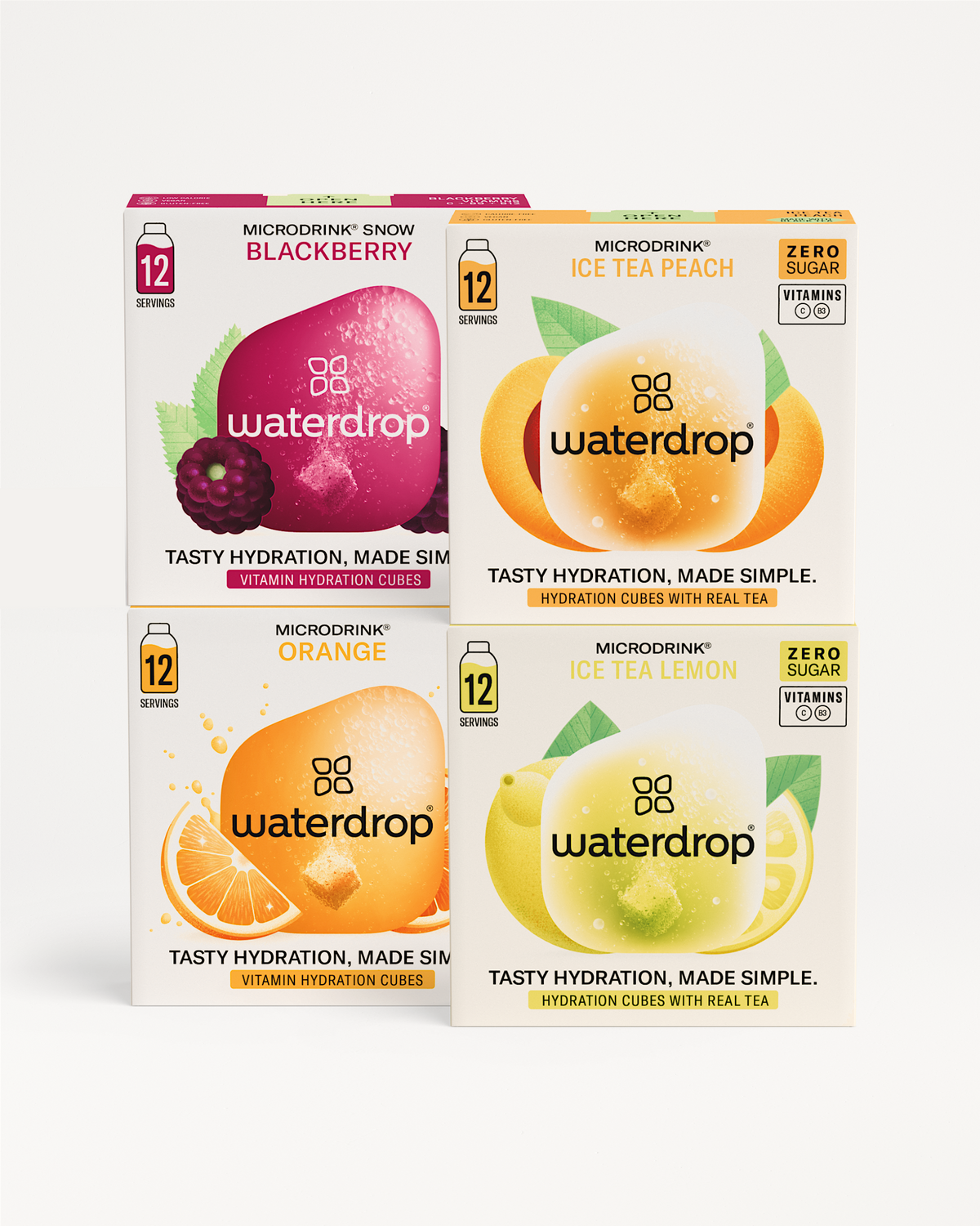 Microdrink Bestseller Set: Vier doosjes Waterdrop® Microdrink hydratatieblokjes met smaken Snow Blackberry, Orange, Ice Tea Peach, en Ice Tea Lemon. Elke doos bevat 12 porties en benadrukt eenvoudige, smakelijke hydratatie.