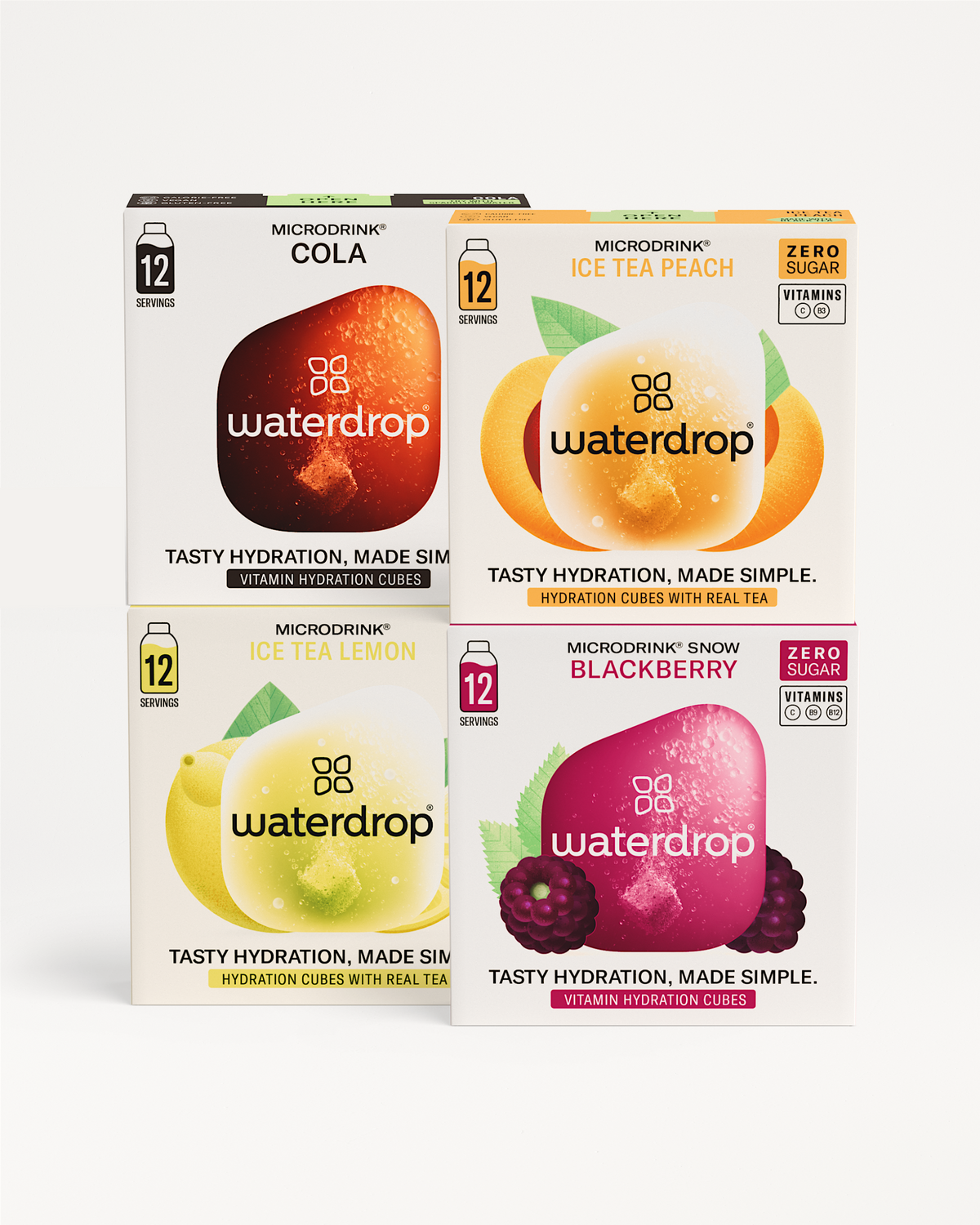 Microdrink Bestseller Set: Vier kartonnen dozen met Waterdrop hydratatieblokjes in de smaken Cola, Ice Tea Perzik, Ice Tea Citroen en Snow Blackberry. Elke doos bevat 12 smaakvolle, suikervrije blokjes.