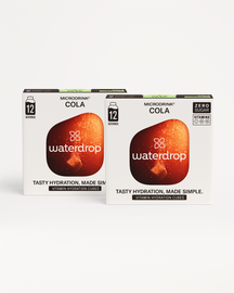 Fizzy Refreshment Twin-pack: Twee dozen waterdrop Microdrink Cola met 12 porties. Zero-suiker, bevat vitamines C, B₃, B₅. Slogan: Tasty hydration, made simple. Bespaar met deze suikervrije, frisdrank-geïnspireerde smaken.