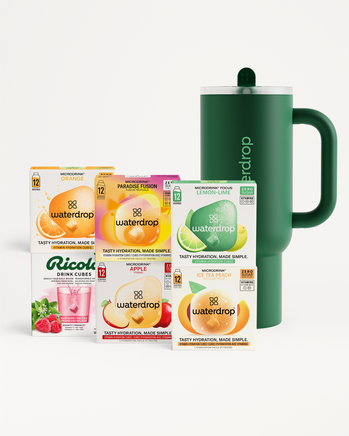 Explorer bestsellerset voor kerst toont Waterdrop Microdrink dozen in diverse smaken naast een donker groene geïsoleerde beker. Inclusief Ricola Raspberry Melissa drinkblokjes, ideaal voor feestelijke hydratatie.