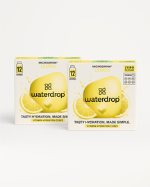 Twee retaildozen van Waterdrop's Microdrink Lemon vitaminehydratatieblokjes, genaamd Fizzy Refreshment Twin-pack, tonen 12 porties, geen suiker, vitaminevermelding (C, B1, B3, B6, B9, B12), en de slogan Tasty Hydration, Made Simple.