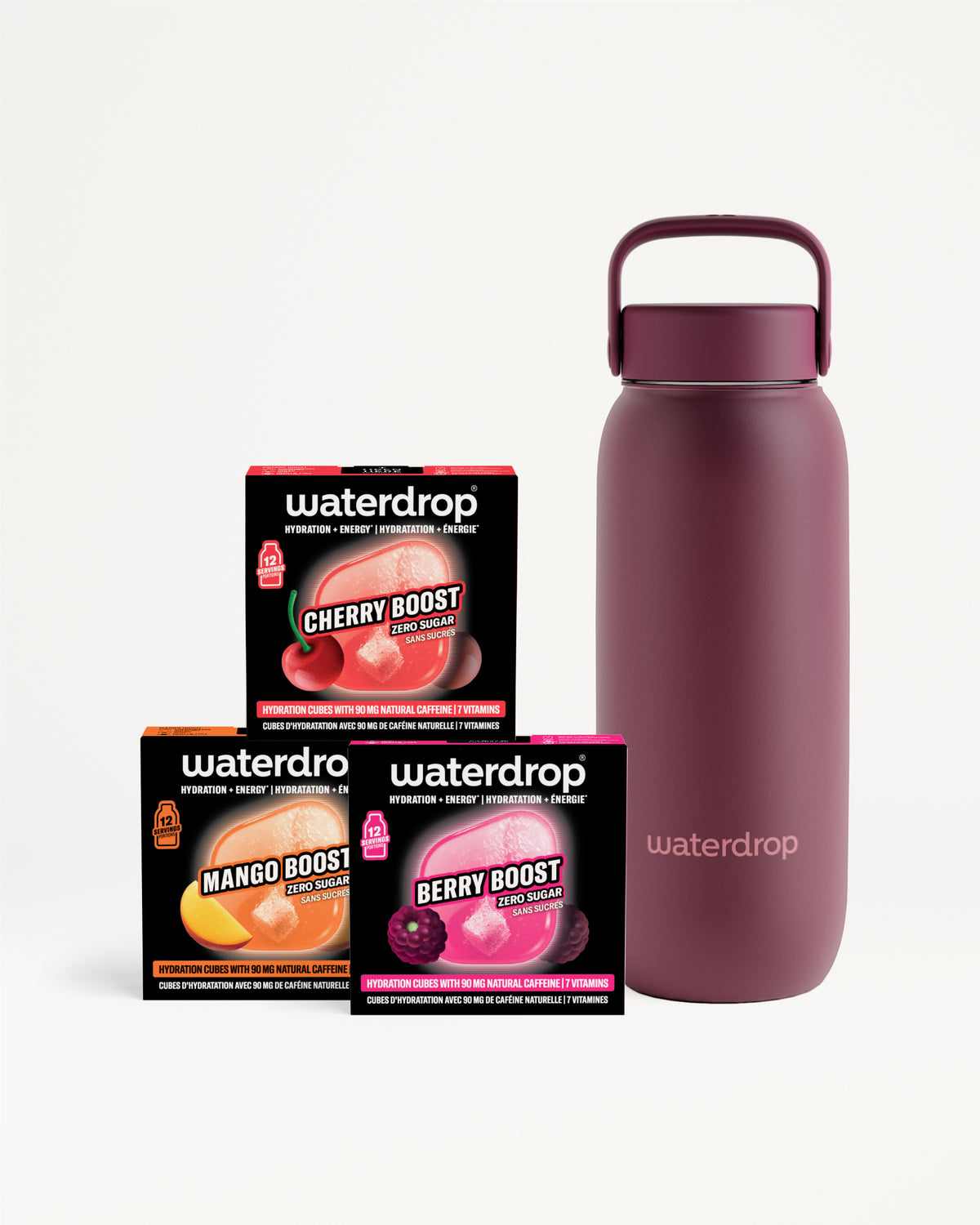 Magenta geïsoleerde waterfles met handvat naast drie kleine zwarte doosjes.