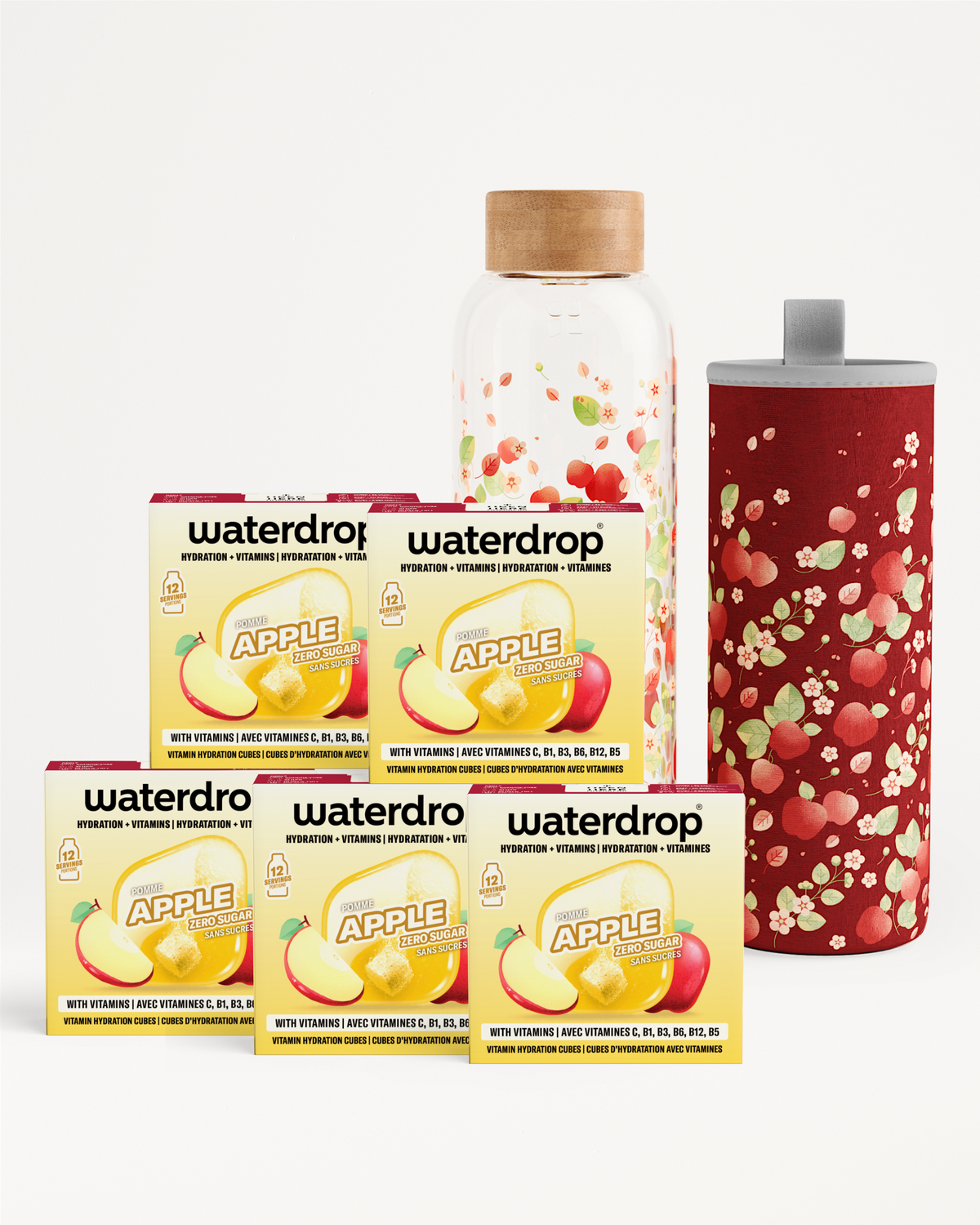 Verschillende Waterdrop-producten met dozen en flessen, een fles met houten dop en een rood geornamenteerde beker.