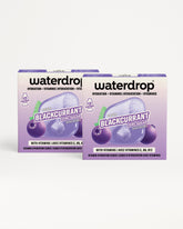 Twee paarse Waterdrop dozen met bessenafbeelding.