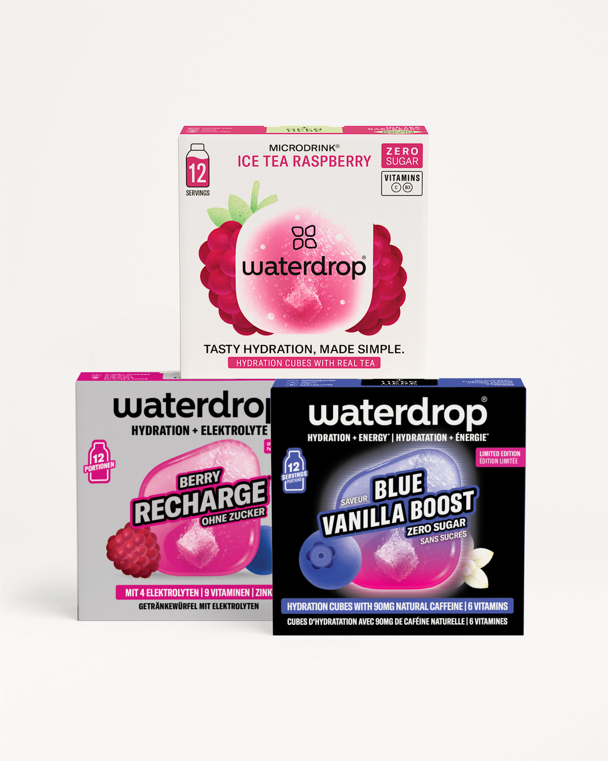 Drie Waterdrop-hydratatieboxen gestapeld in een piramide, met roze, paarse en blauwe verpakkingsontwerpen.
