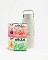 Verse Waterdrop-hydratatieboosters naast een lichtgrijze herbruikbare fles.