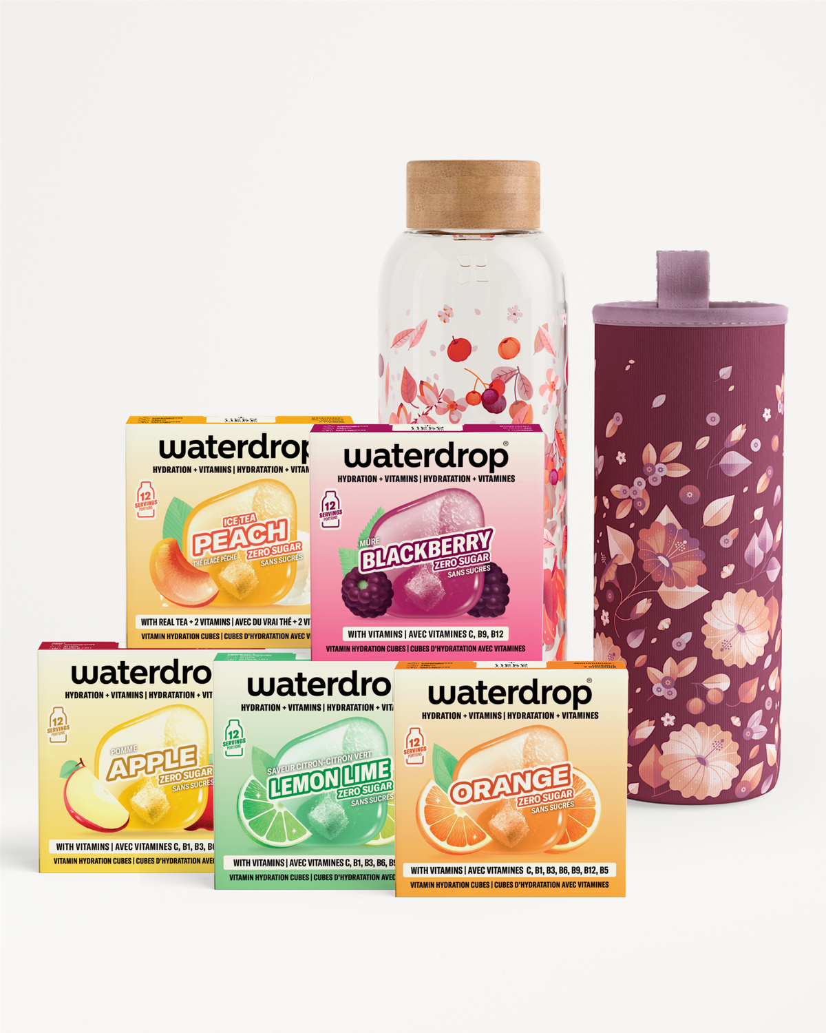 Verschillende doosjes smaakconcentraten en een glazen fles met kurk en bloemige hoes.