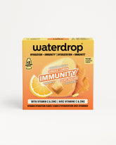 Oranje Waterdrop-immuniteit doos met citroen en gember afbeelding.