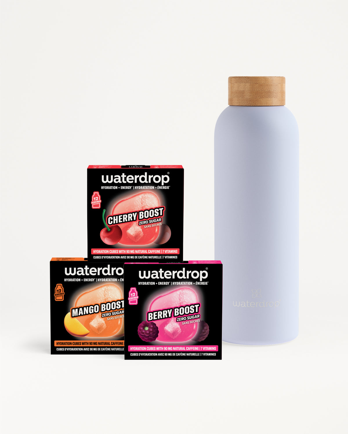 Verschillende Waterdrop-dozen op elkaar gestapeld naast een hoge lichtpaarse fles met kurken deksel.